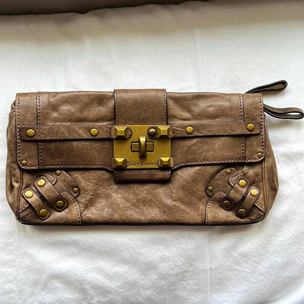Juicy couture brown leather clutch with gold hardware.